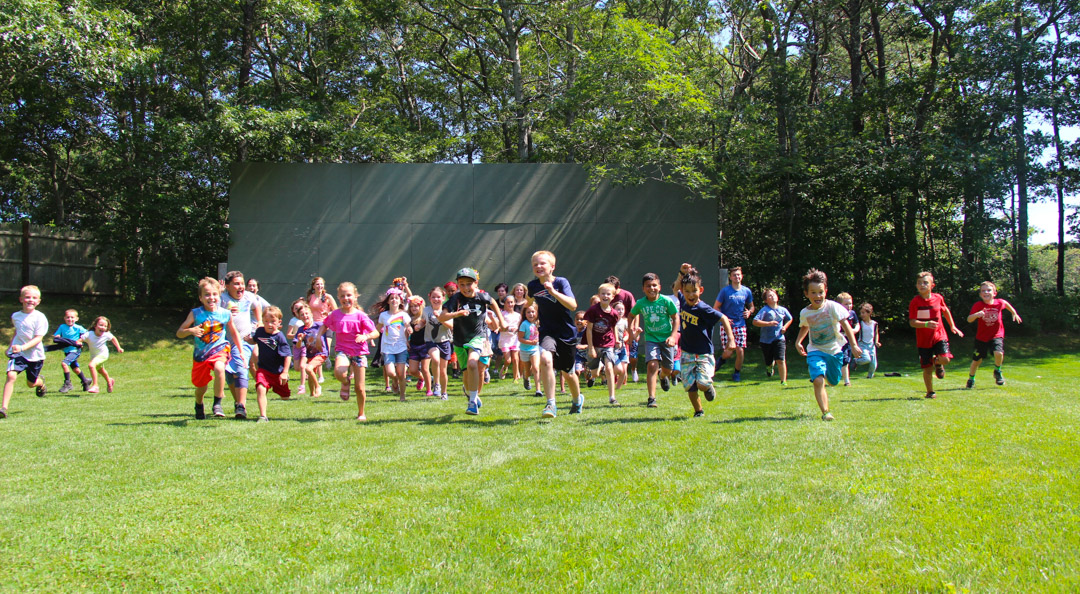 Kids running in grass