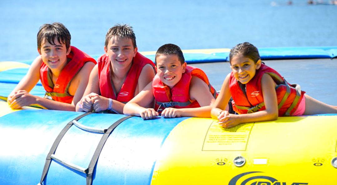 Four kids on water trampoline