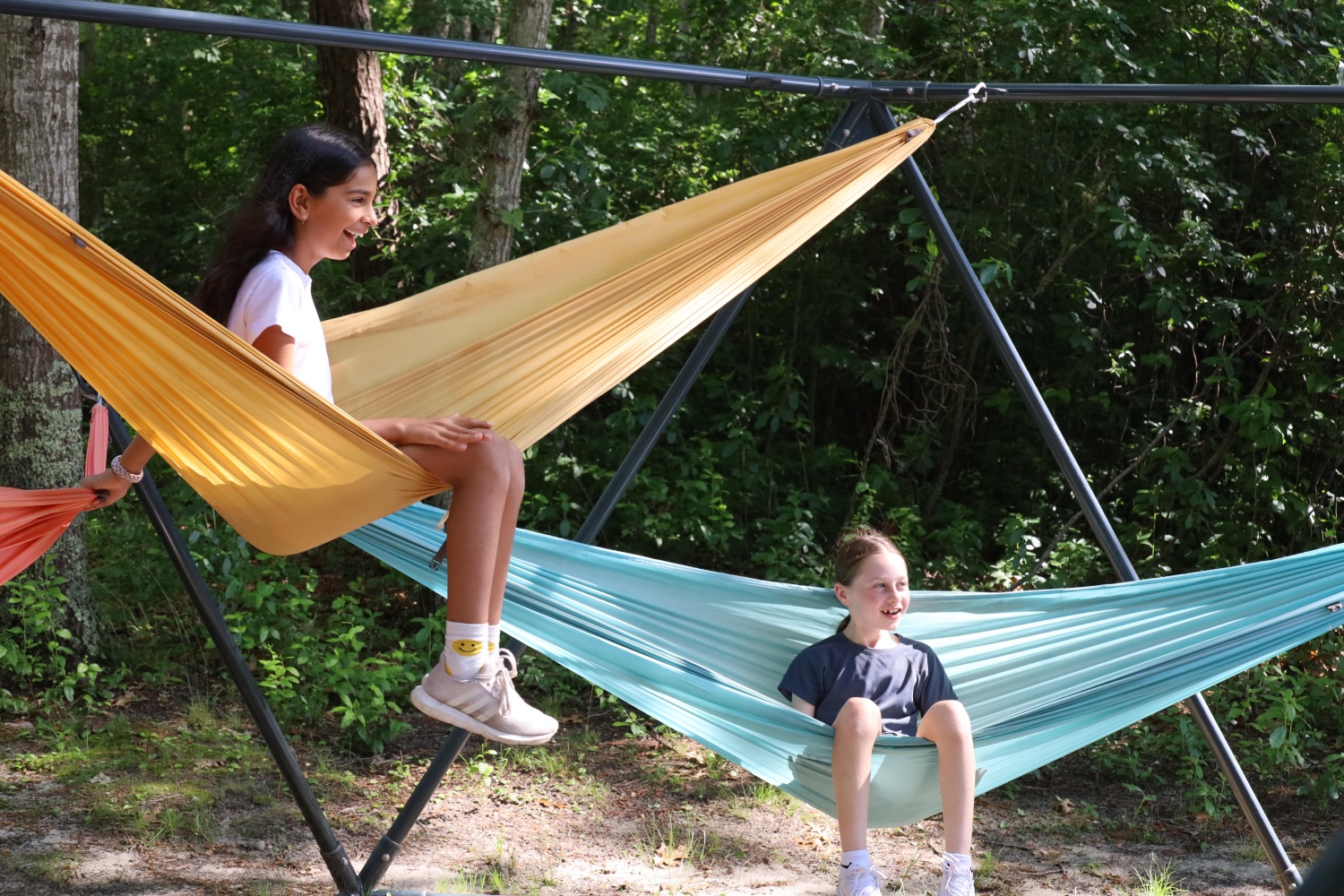 Campers relaxing on hammocks